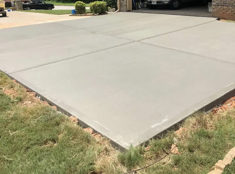 Finished broom-texture concrete slab with clean edges and control joints