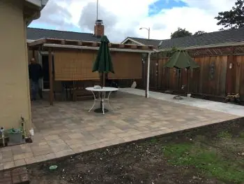 Paver patio under a backyard pergola